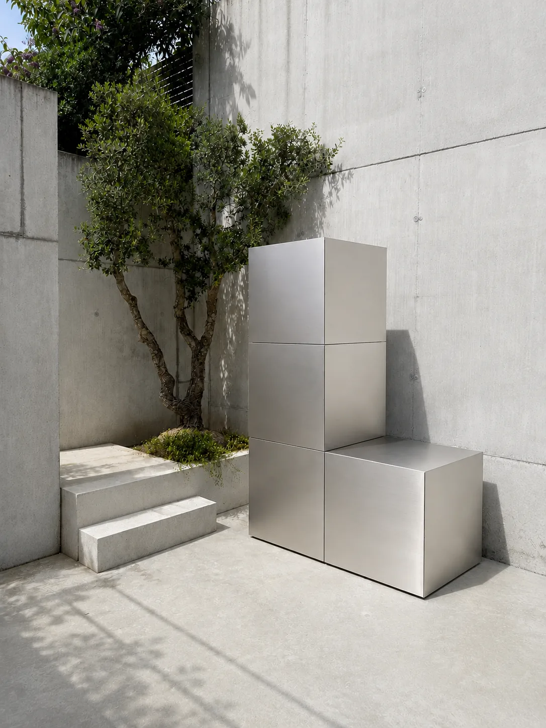 RO. brushed stainless steel modular composition against a concrete wall